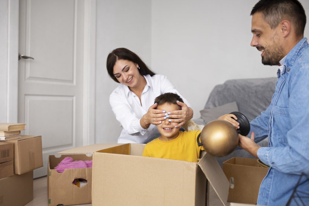 Family moving into a new home with RemovalSquad’s man and van services in London